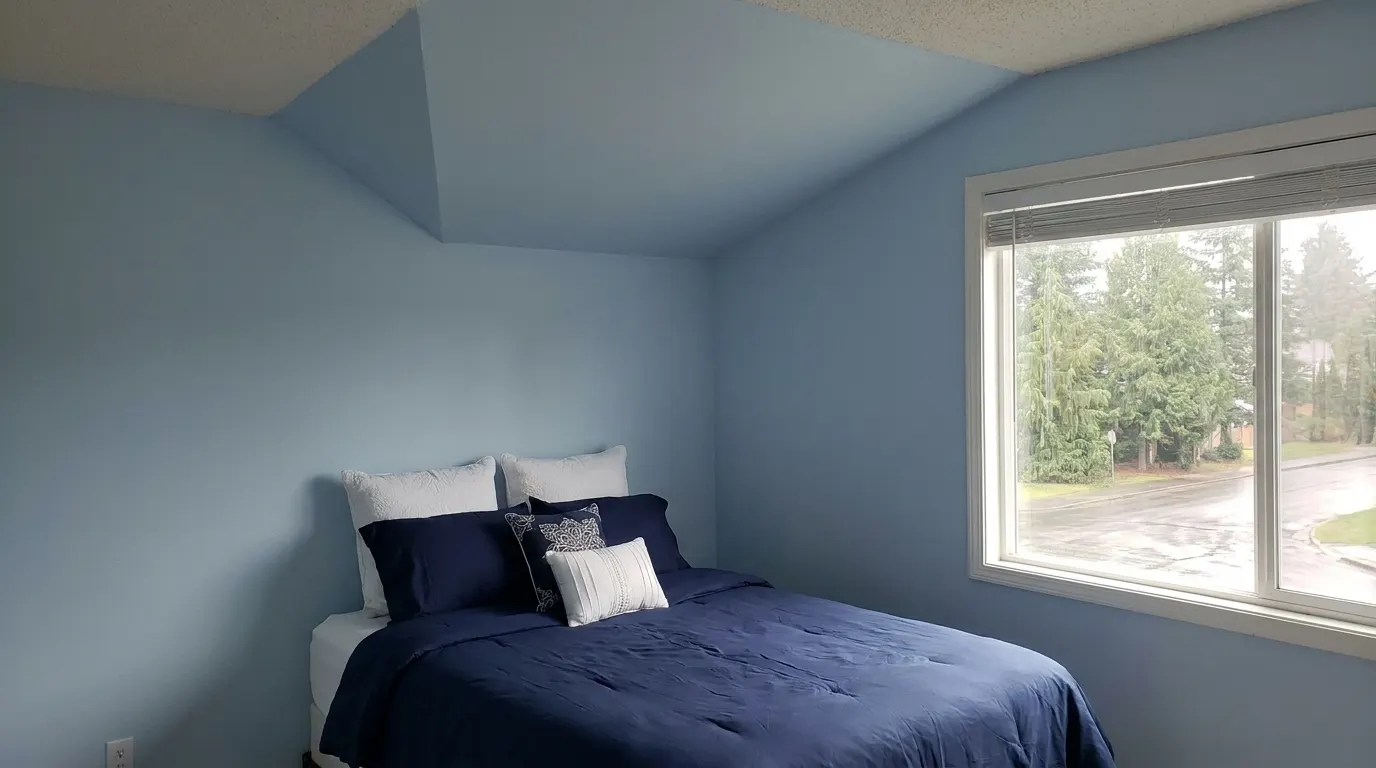Same bedroom with rebuilt ceiling after storm damage restoration